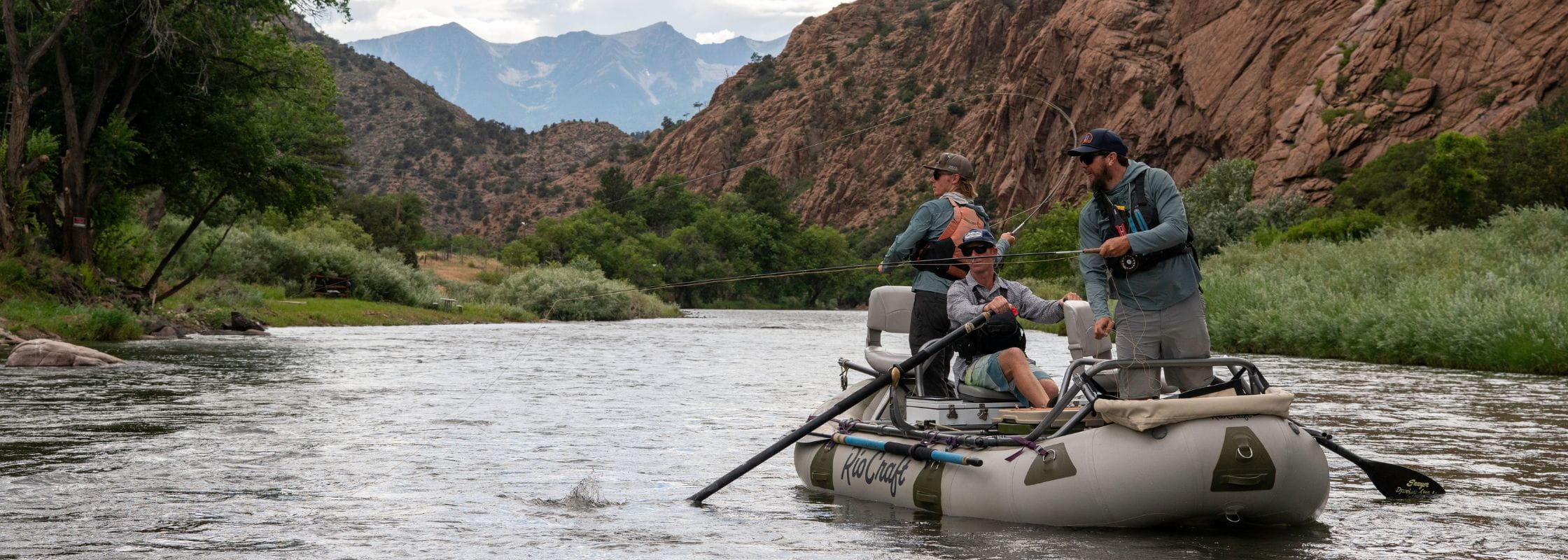 A raft going down Browns Canyon on an overnight fly fishing trip