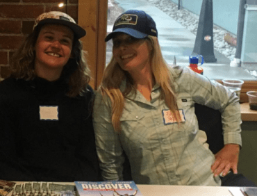 Two smiling reservationists employed by Arkansas River Tours