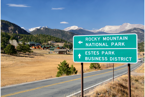 Road sign of colorado springs and rocky mountain park