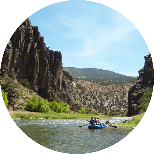 Scenic vista and raft on multi-day gunnison gorge rafting trip