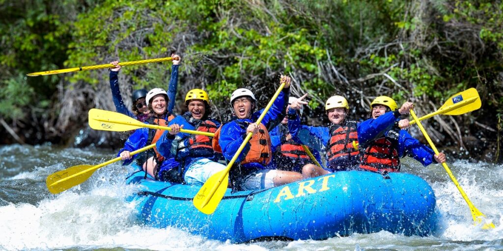 group of people whitewater rafting